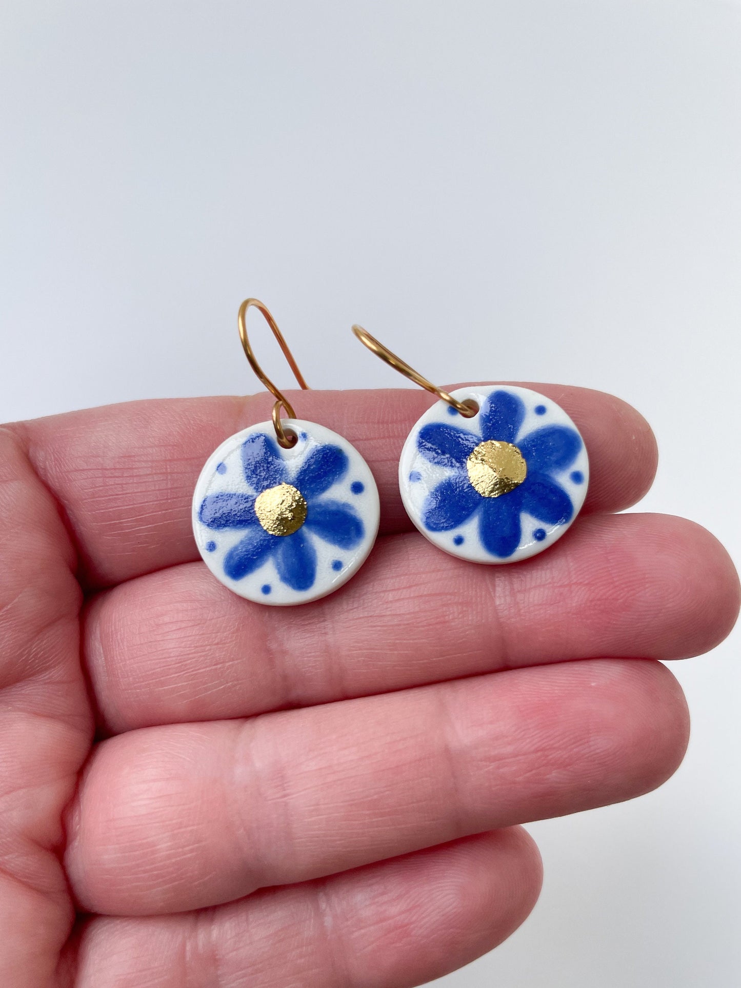 Hand Painted Dark Blue Flower Dangle earrings with gold centre