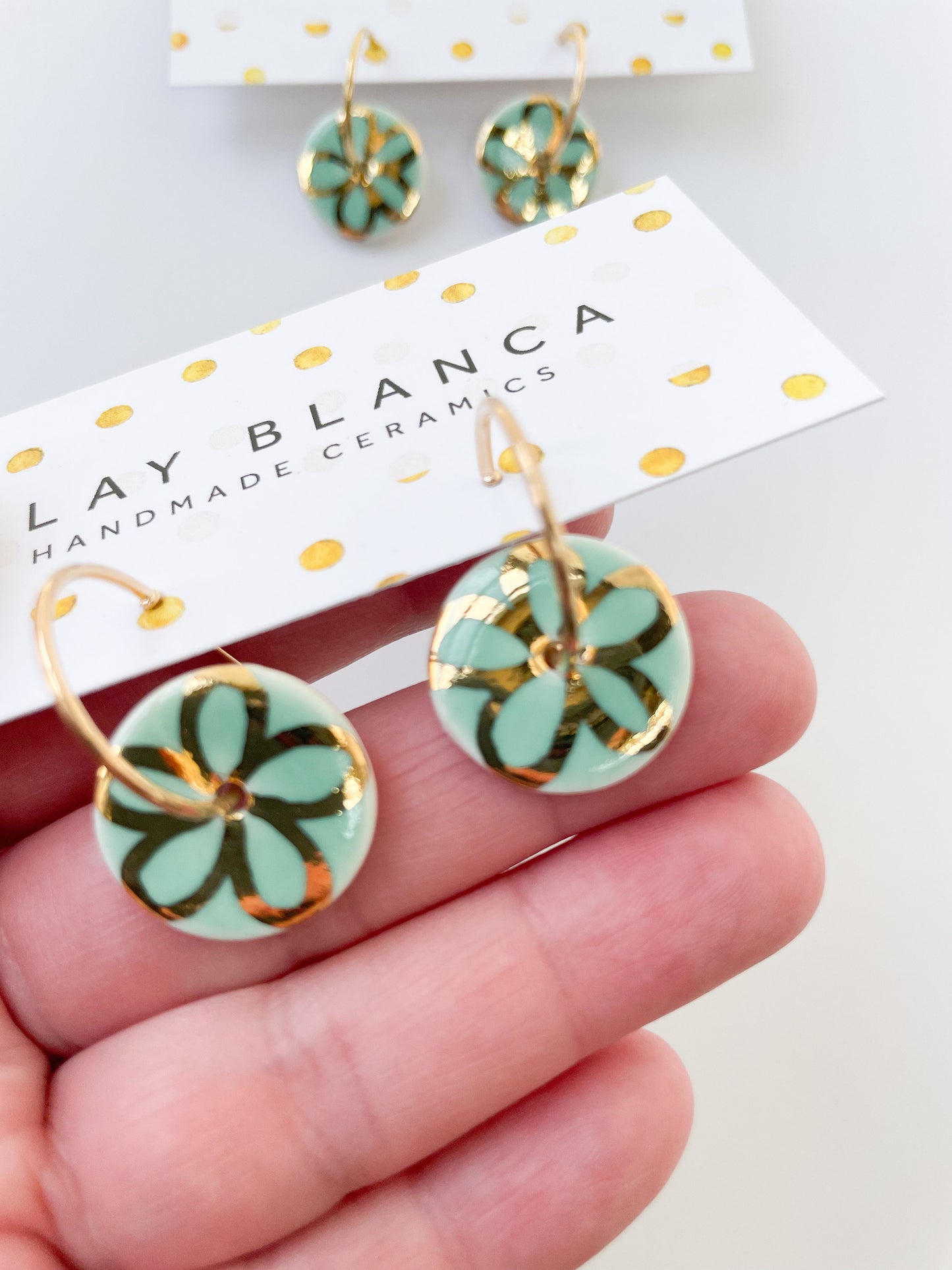 Round Mint green earrings with gold flower design