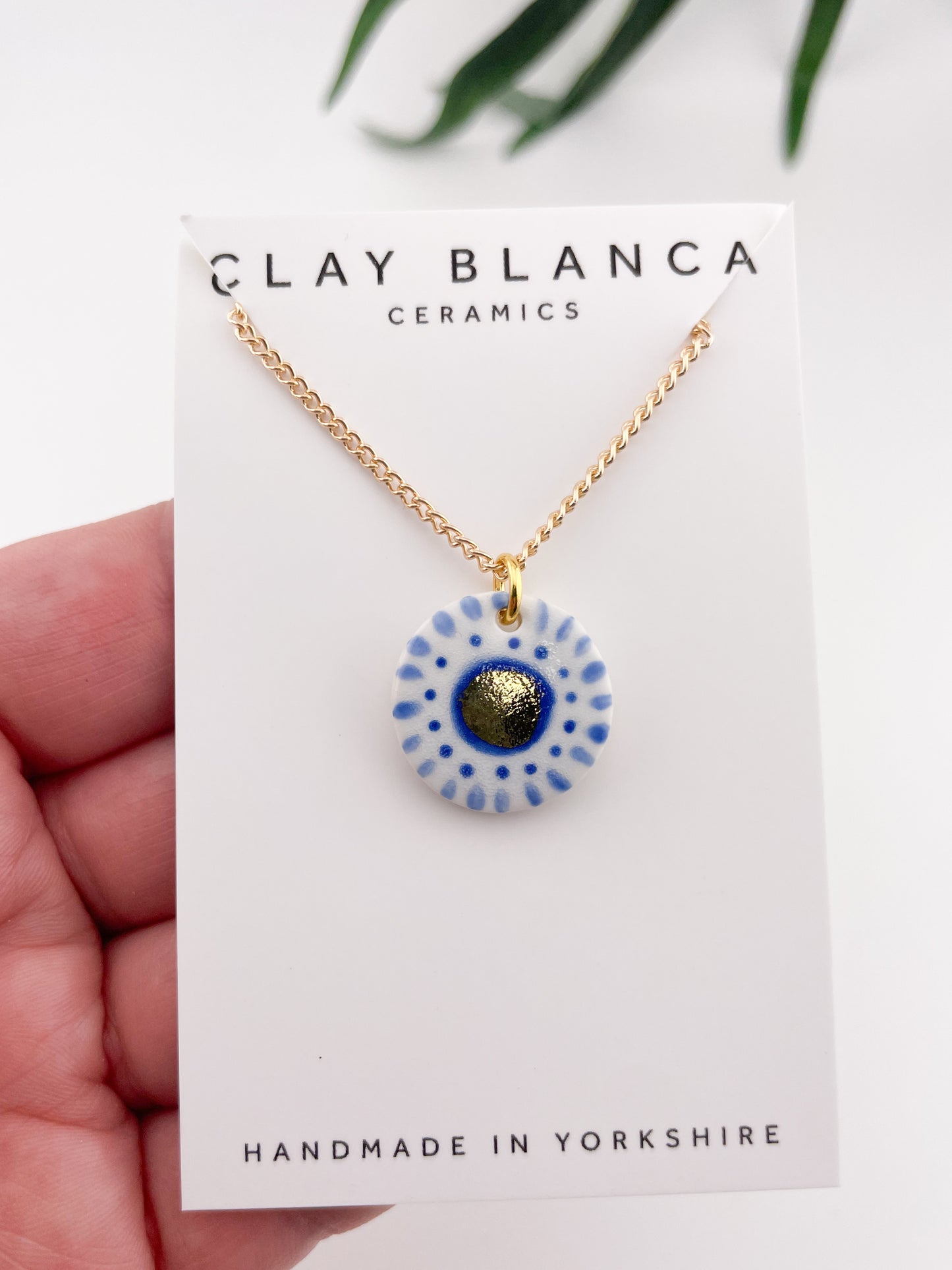 Hand painted white and blue dot pendant with gold lustre centre