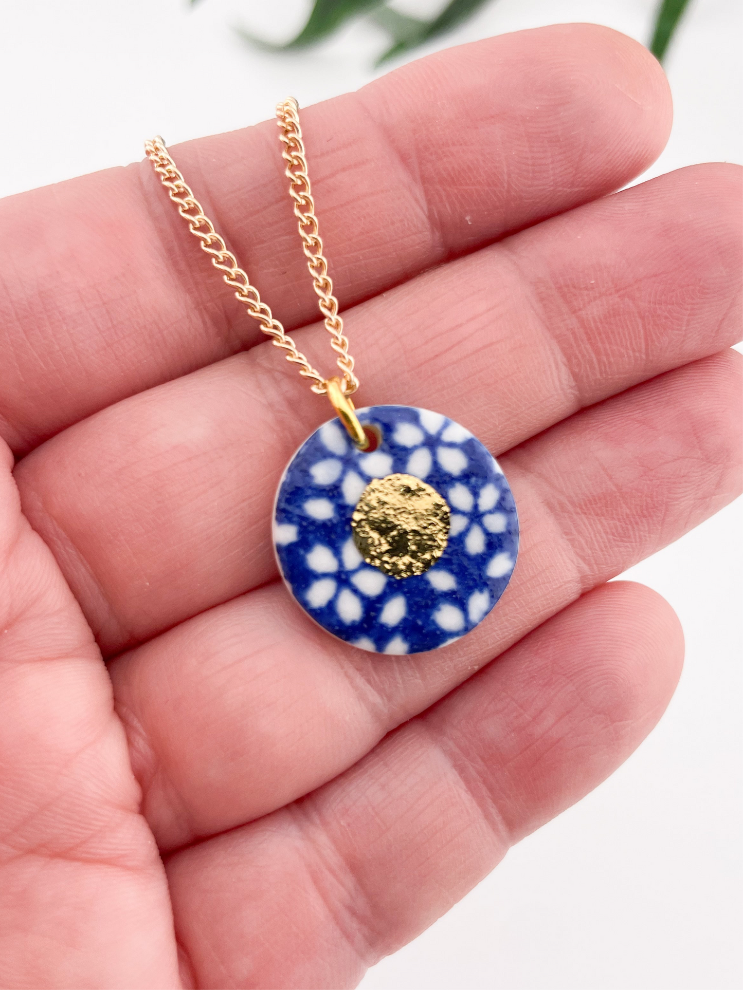 Blue Pendant with white flowers pattern & gold lustre centre