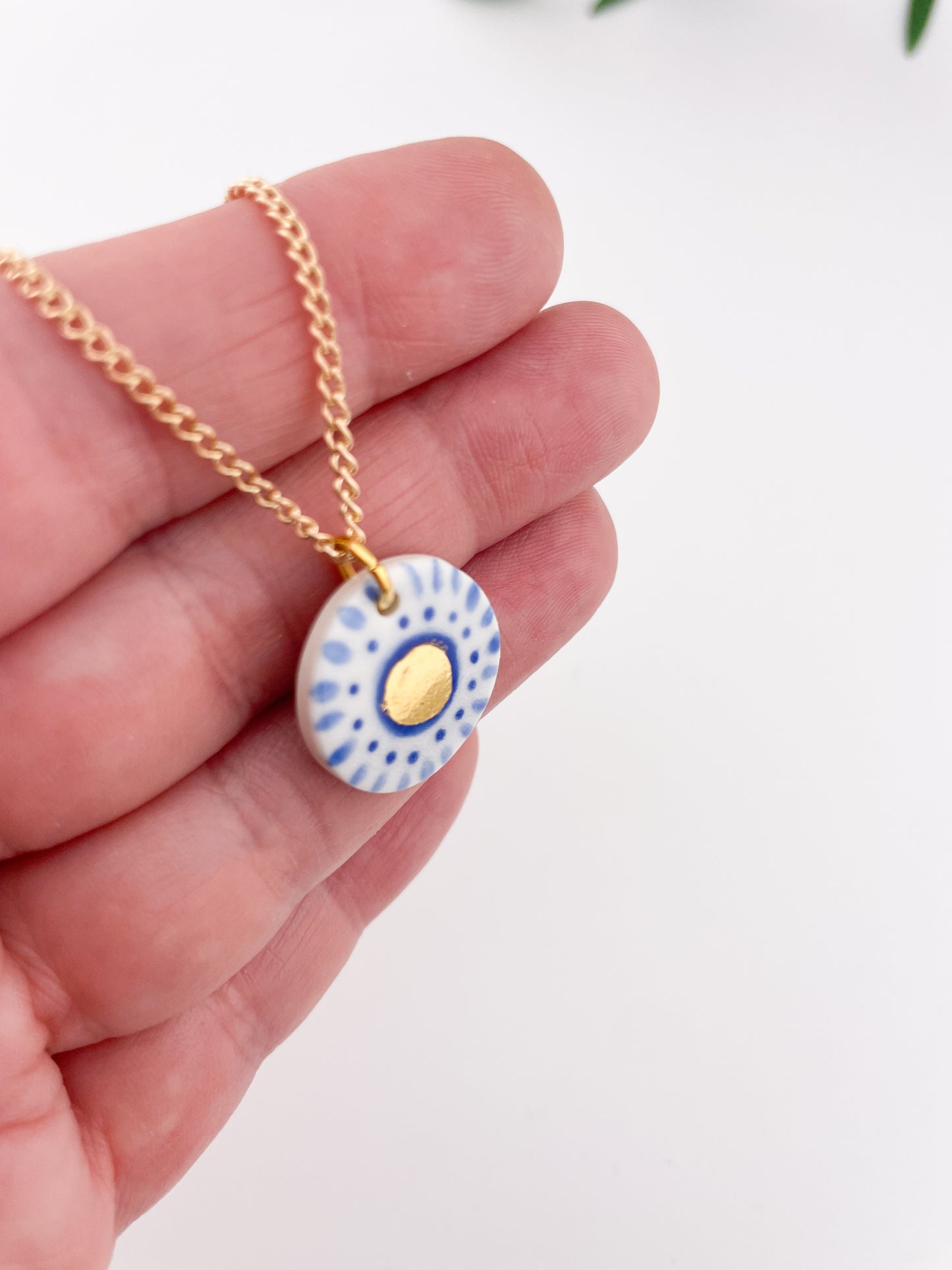 Hand painted white and blue dot pendant with gold lustre centre