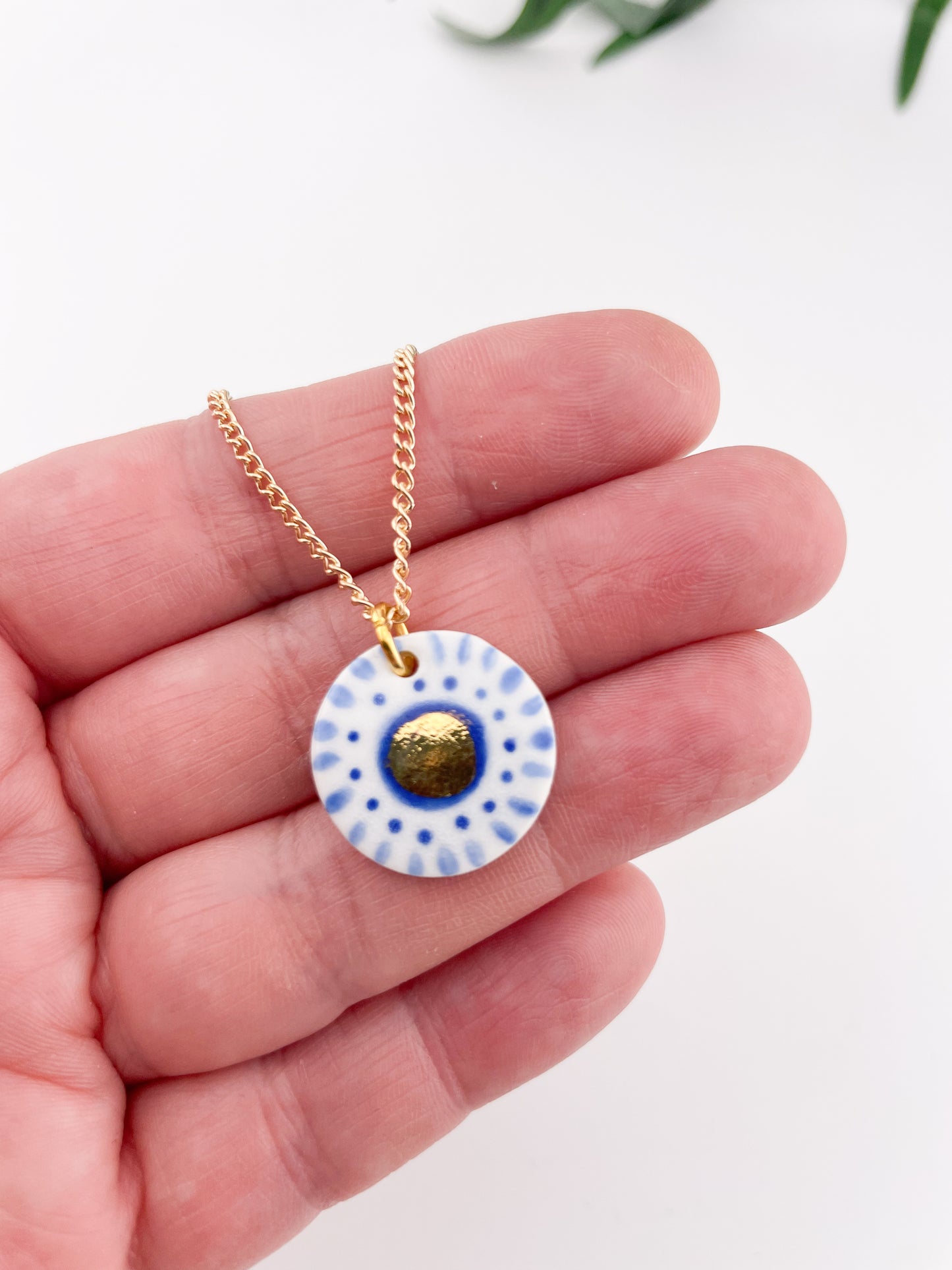 Hand painted white and blue dot pendant with gold lustre centre