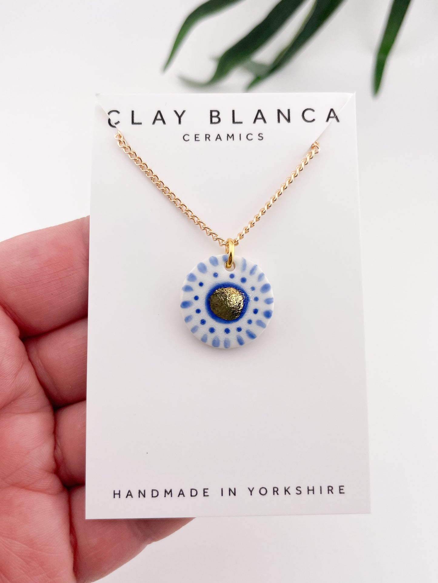 Hand painted white and blue dot pendant with gold lustre centre