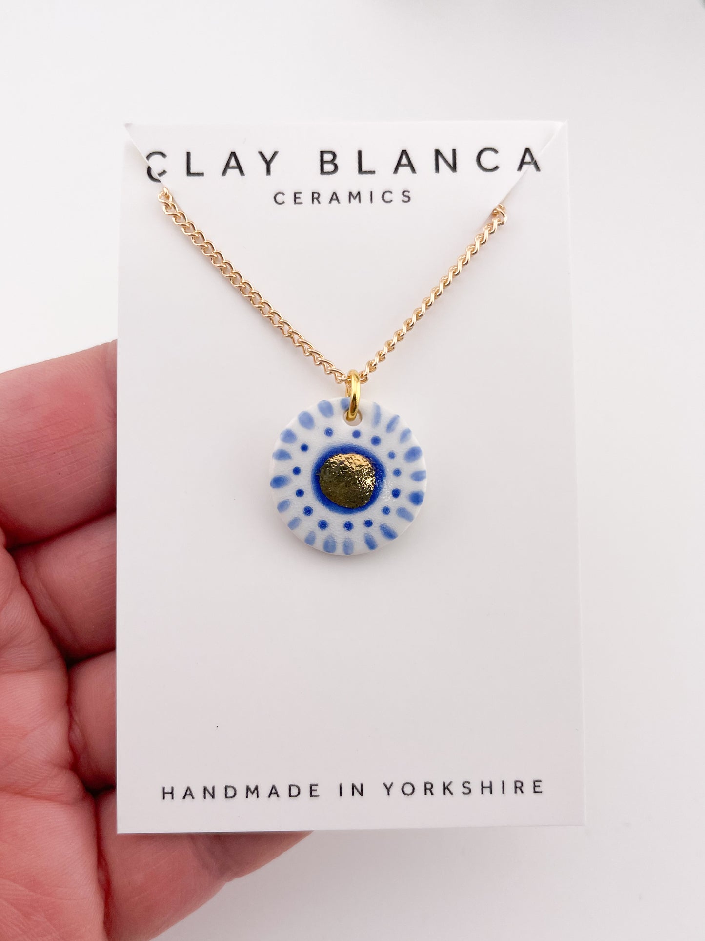 Hand painted white and blue dot pendant with gold lustre centre