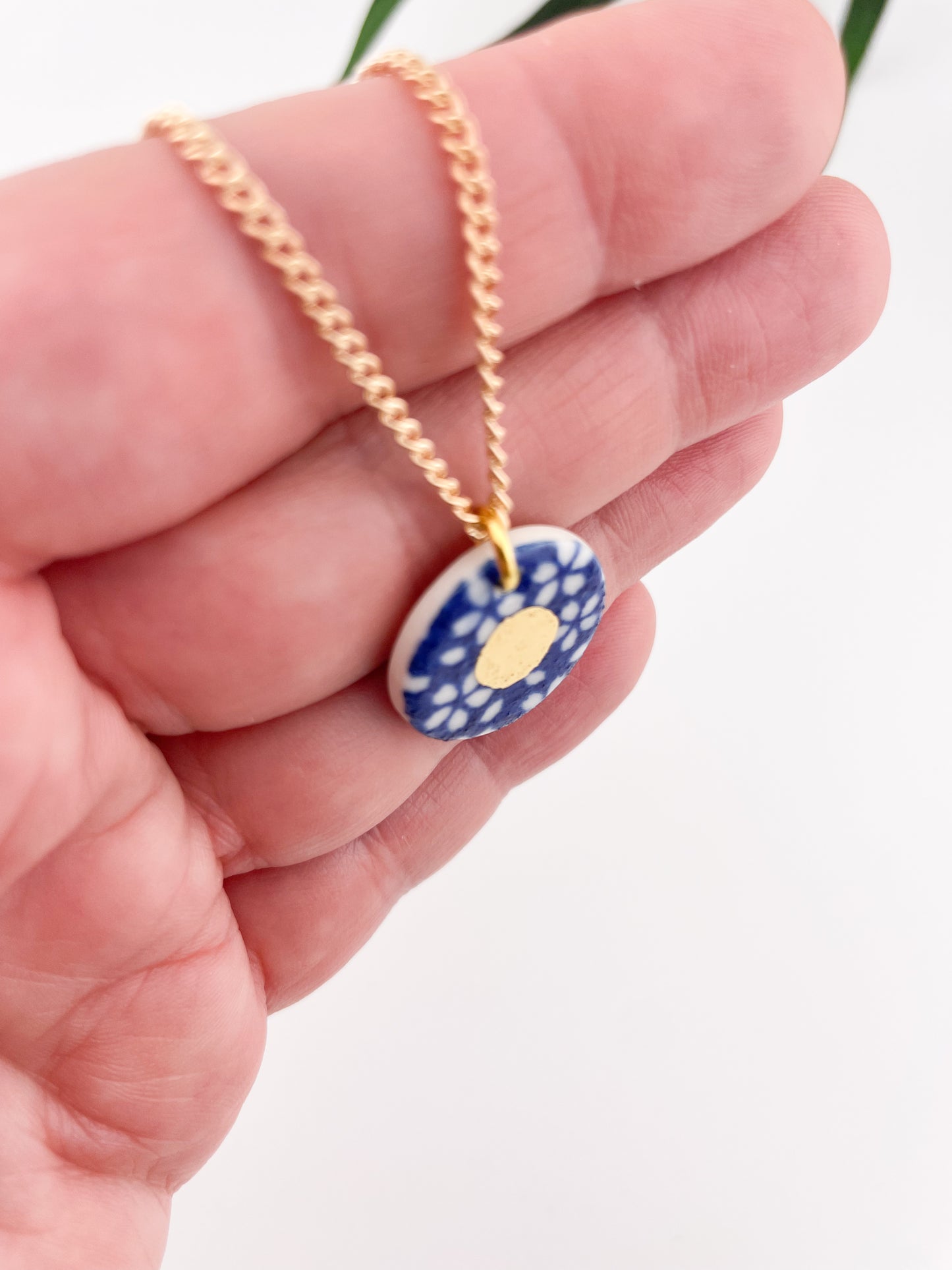 Blue Pendant with white flowers pattern & gold lustre centre