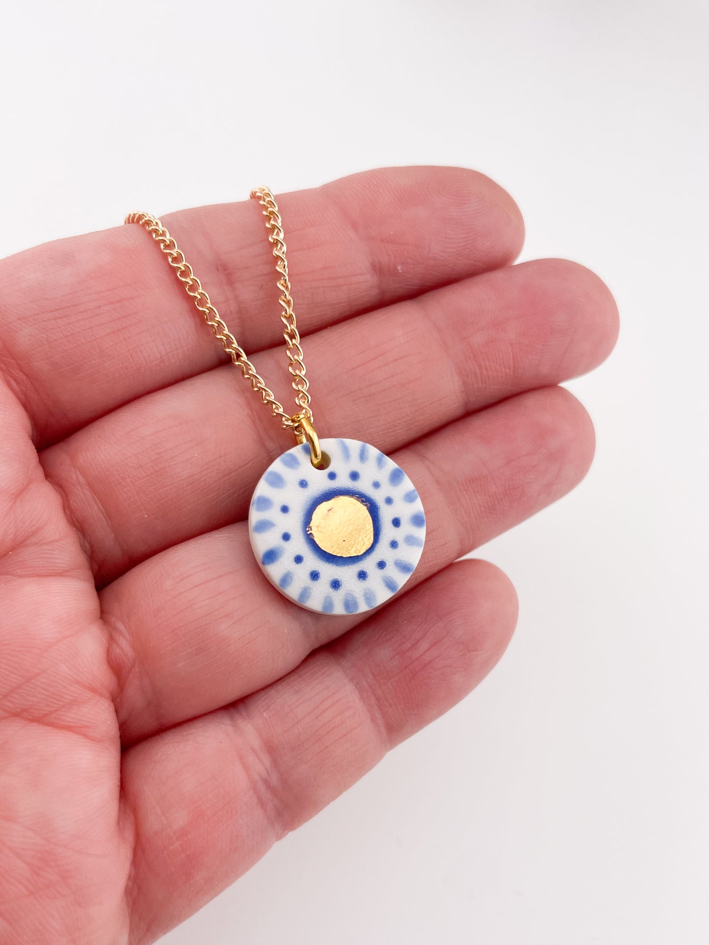 Hand painted white and blue dot pendant with gold lustre centre