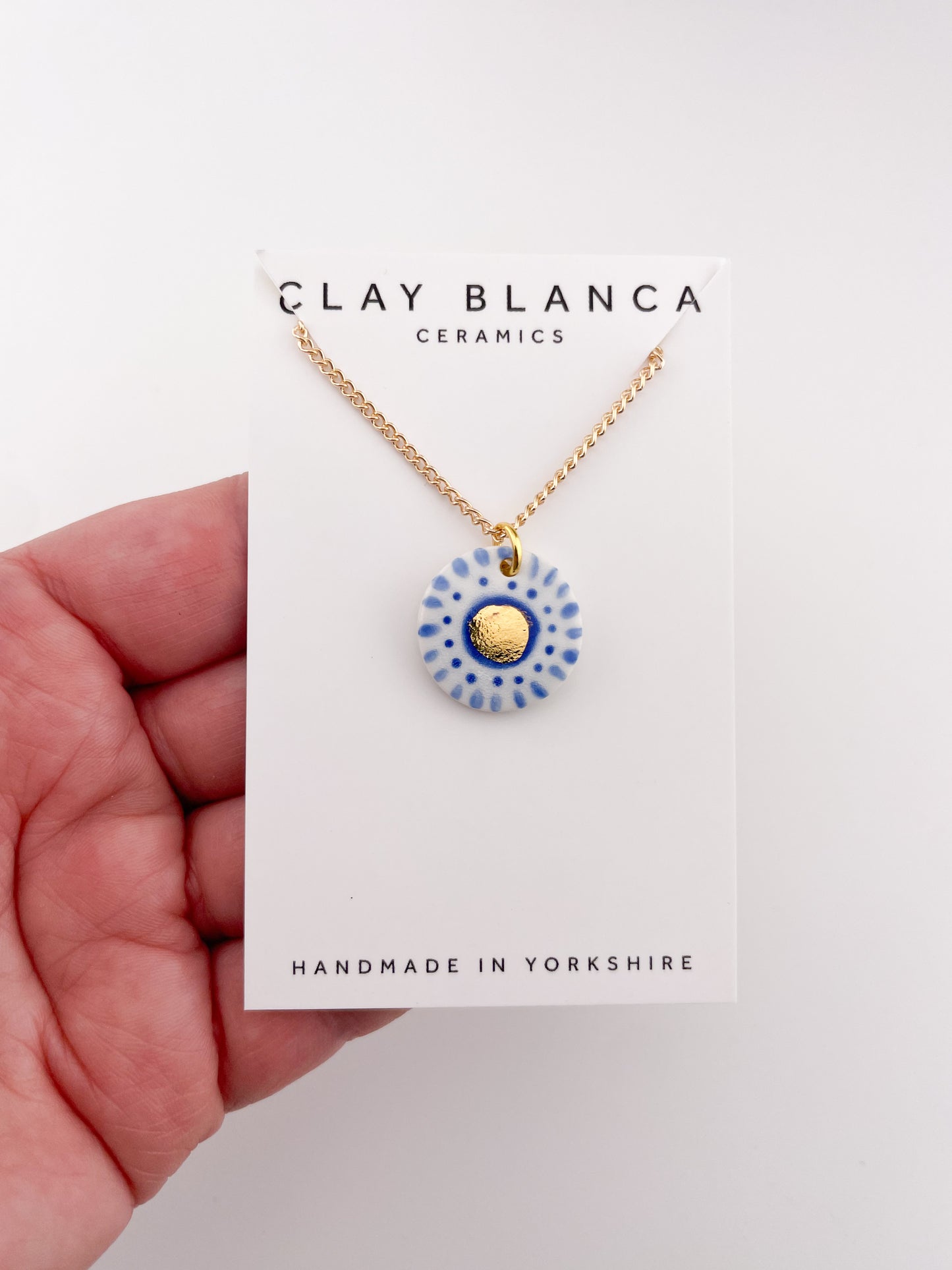 Hand painted white and blue dot pendant with gold lustre centre