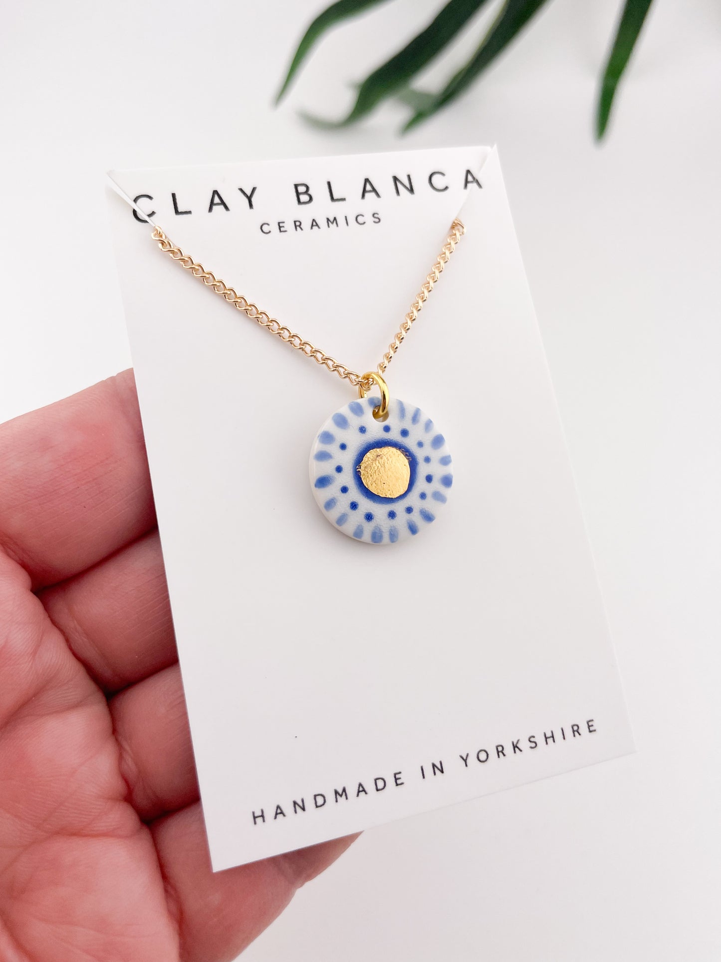 Hand painted white and blue dot pendant with gold lustre centre