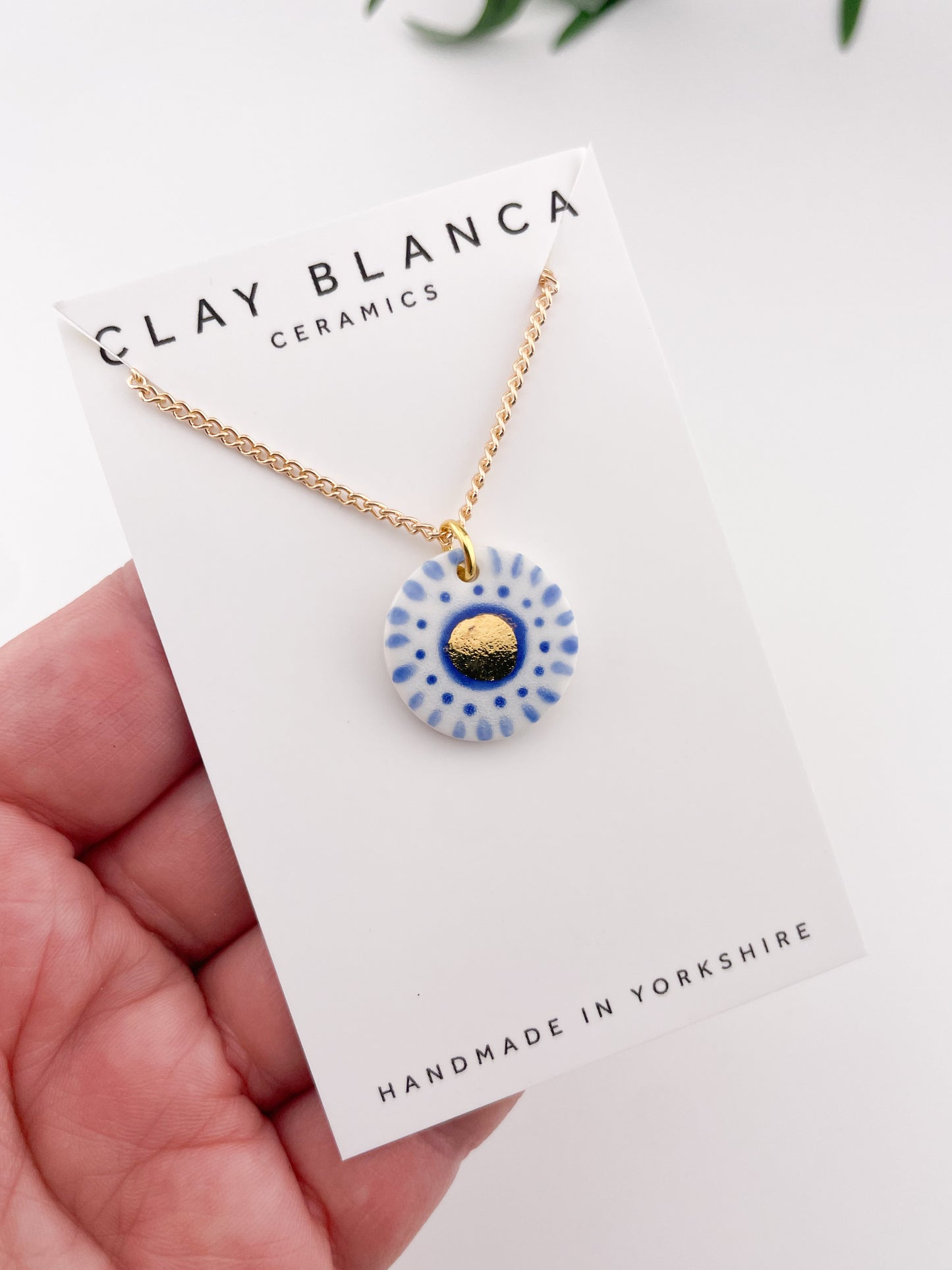 Hand painted white and blue dot pendant with gold lustre centre