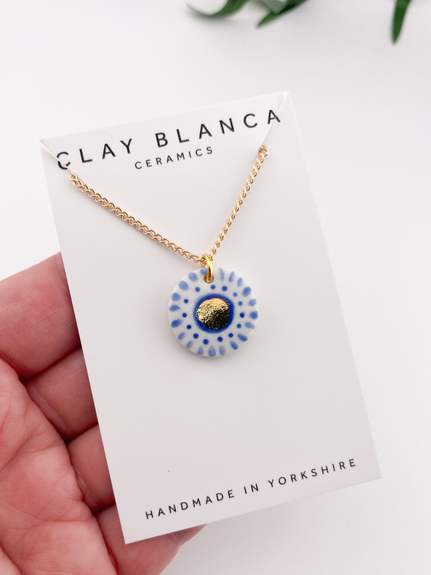 Hand painted white and blue dot pendant with gold lustre centre