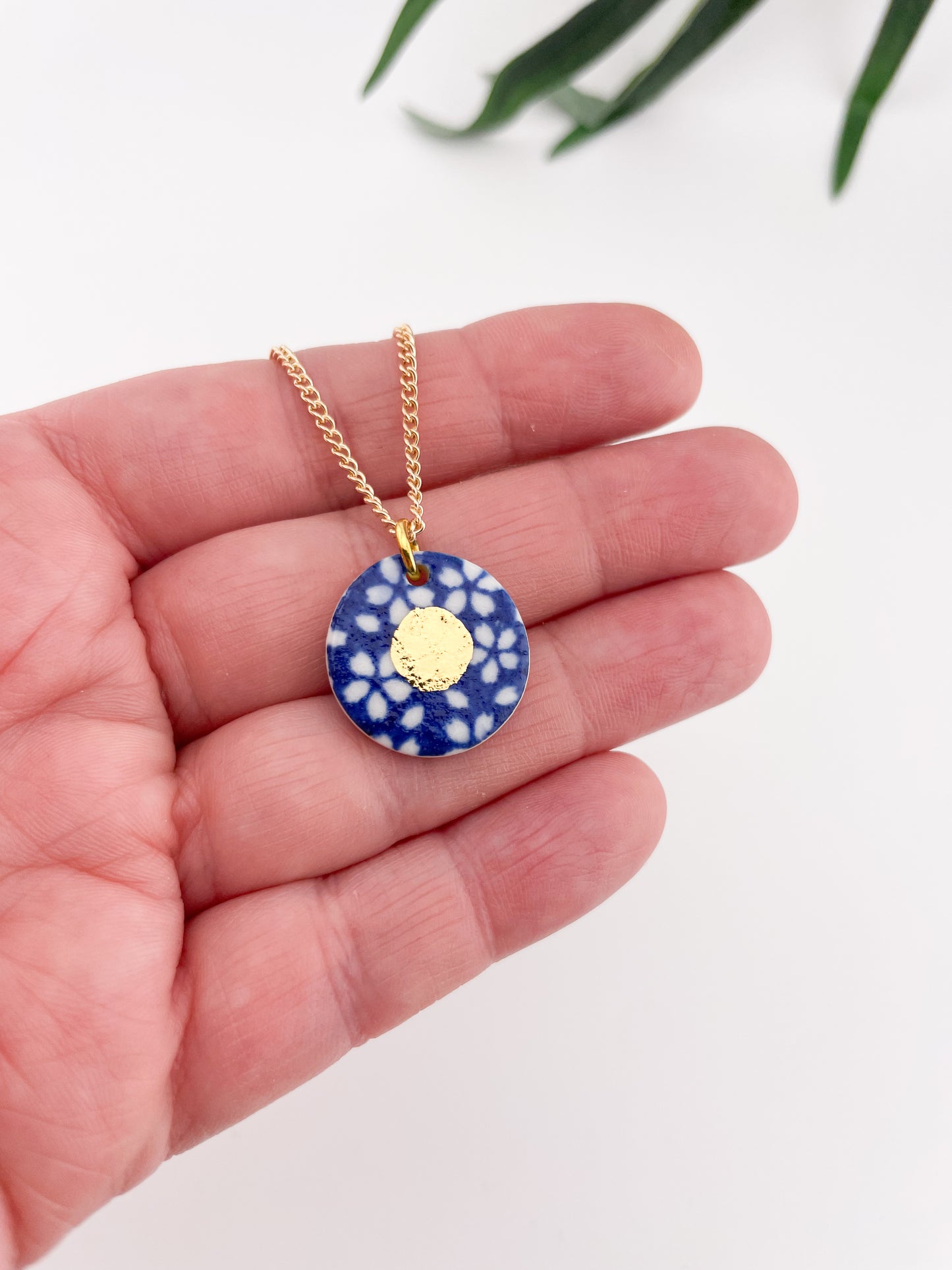 Blue Pendant with white flowers pattern & gold lustre centre