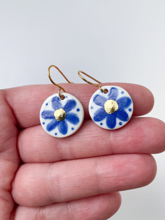 Hand painted blue flower earrings with gold centre