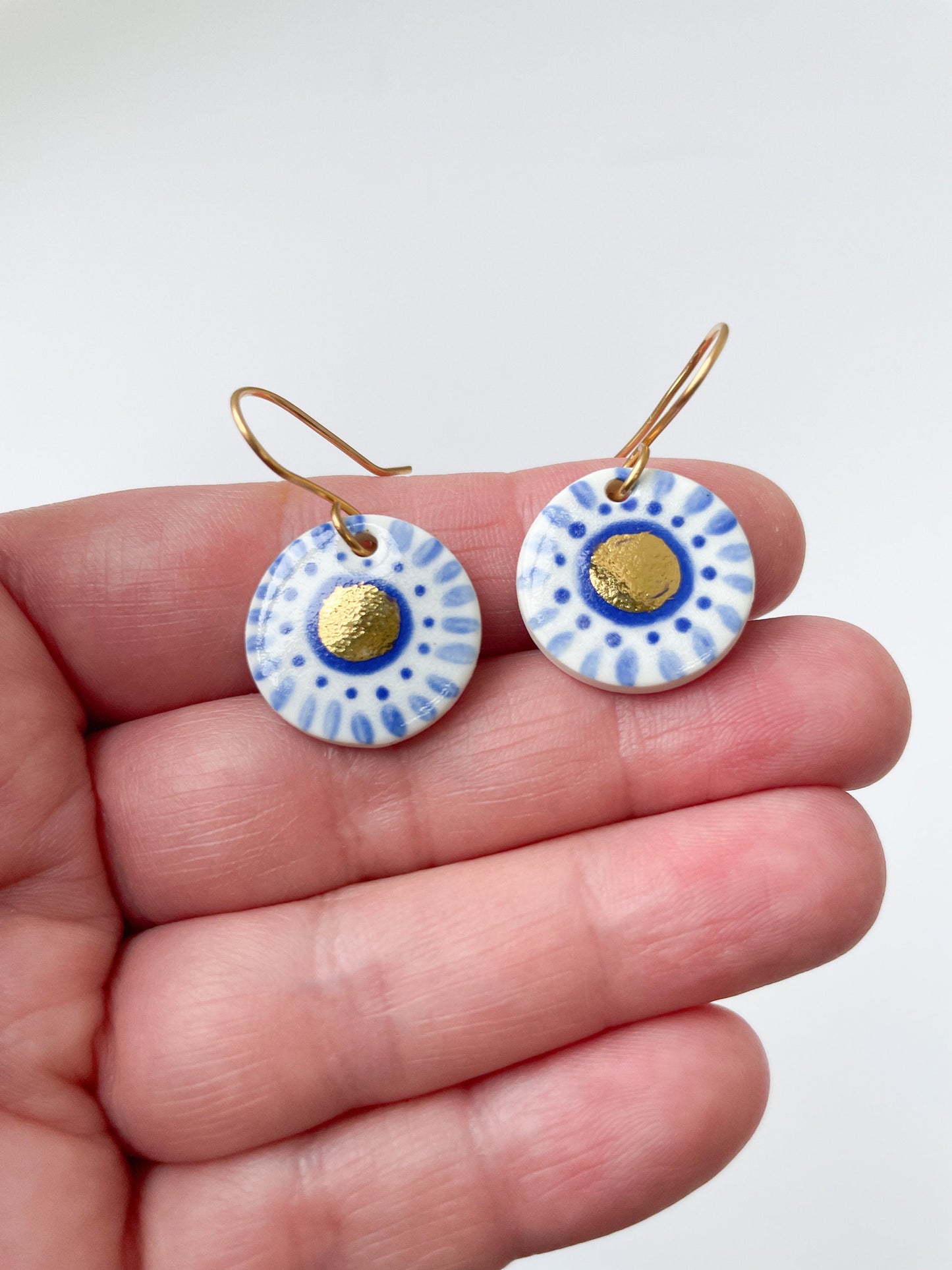 Hand painted white and blue dot earrings with gold lustre centre