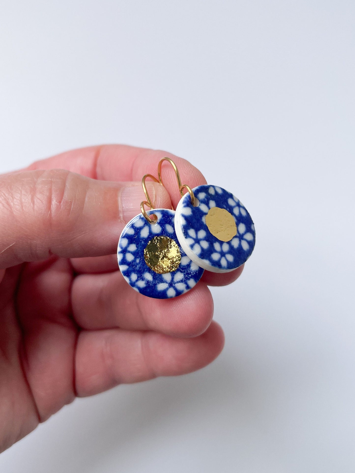 Blue earrings with white flowers pattern & gold lustre centre