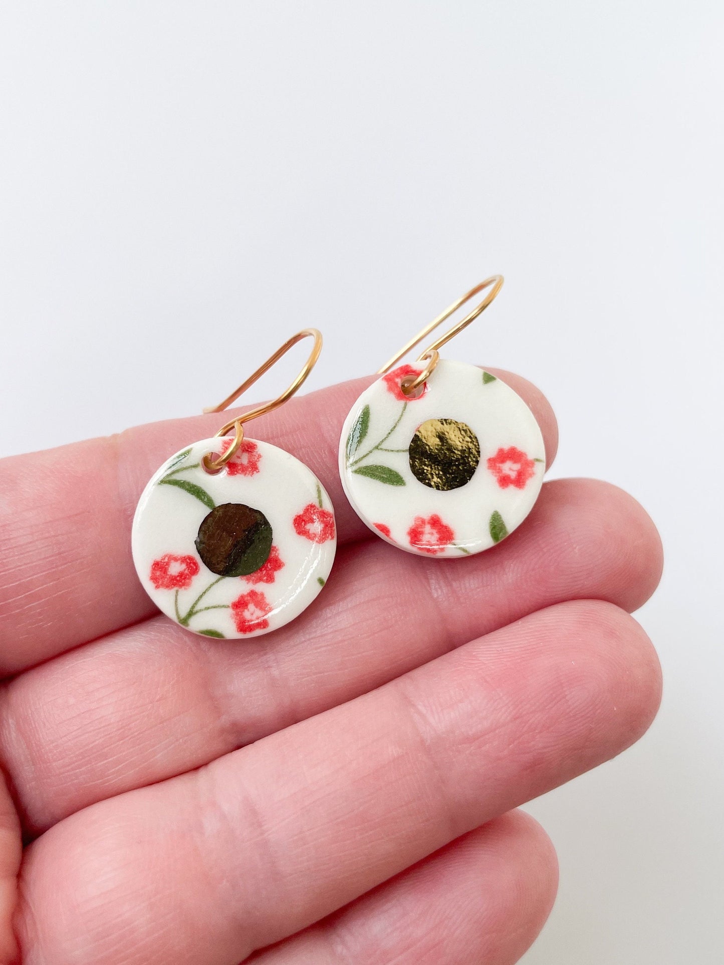 White round earrings with red flowers