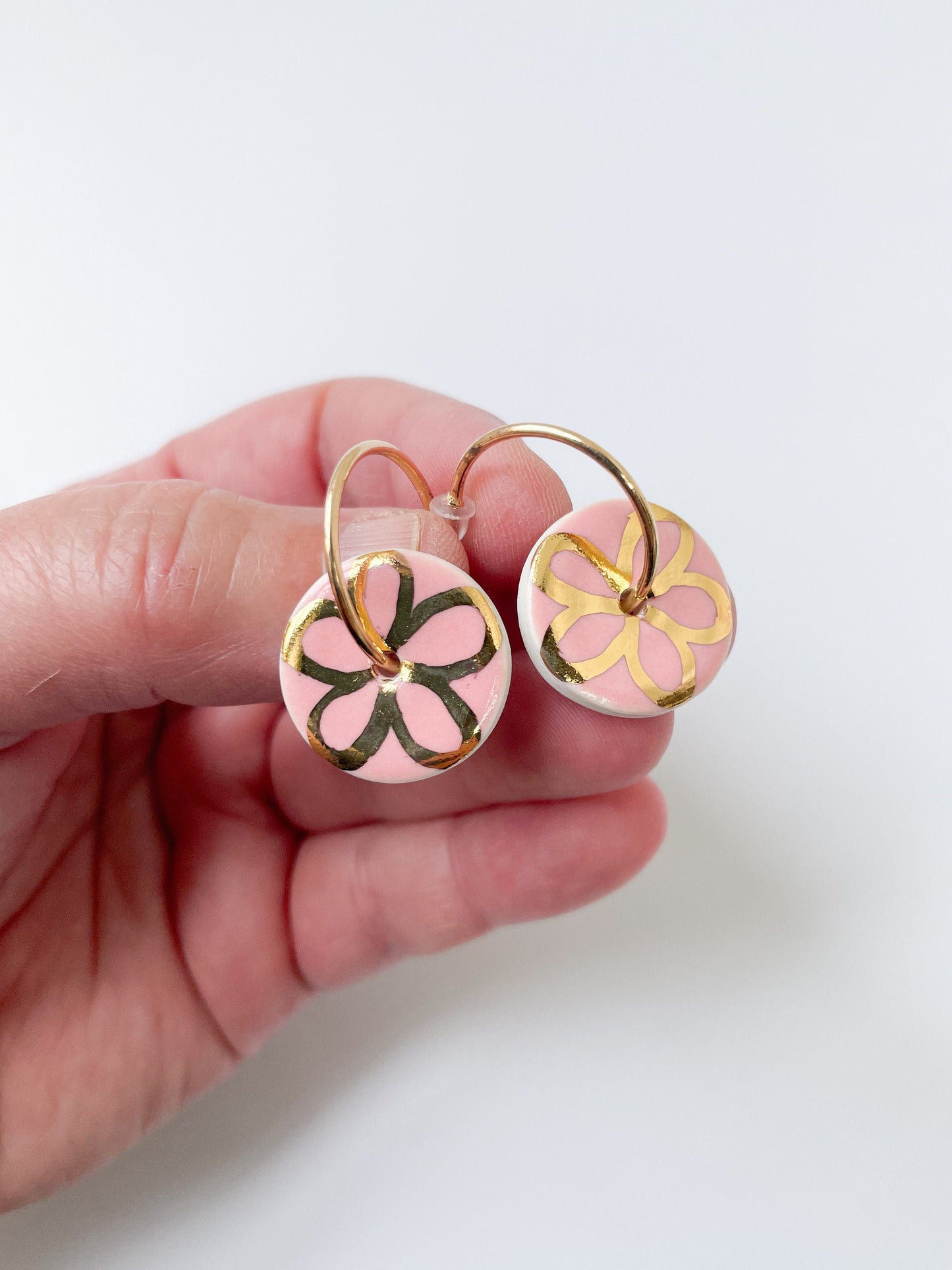 Round Pink earrings with gold flower design