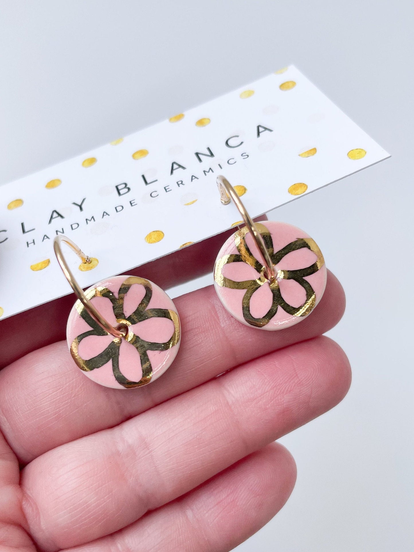 Round Pink earrings with gold flower design