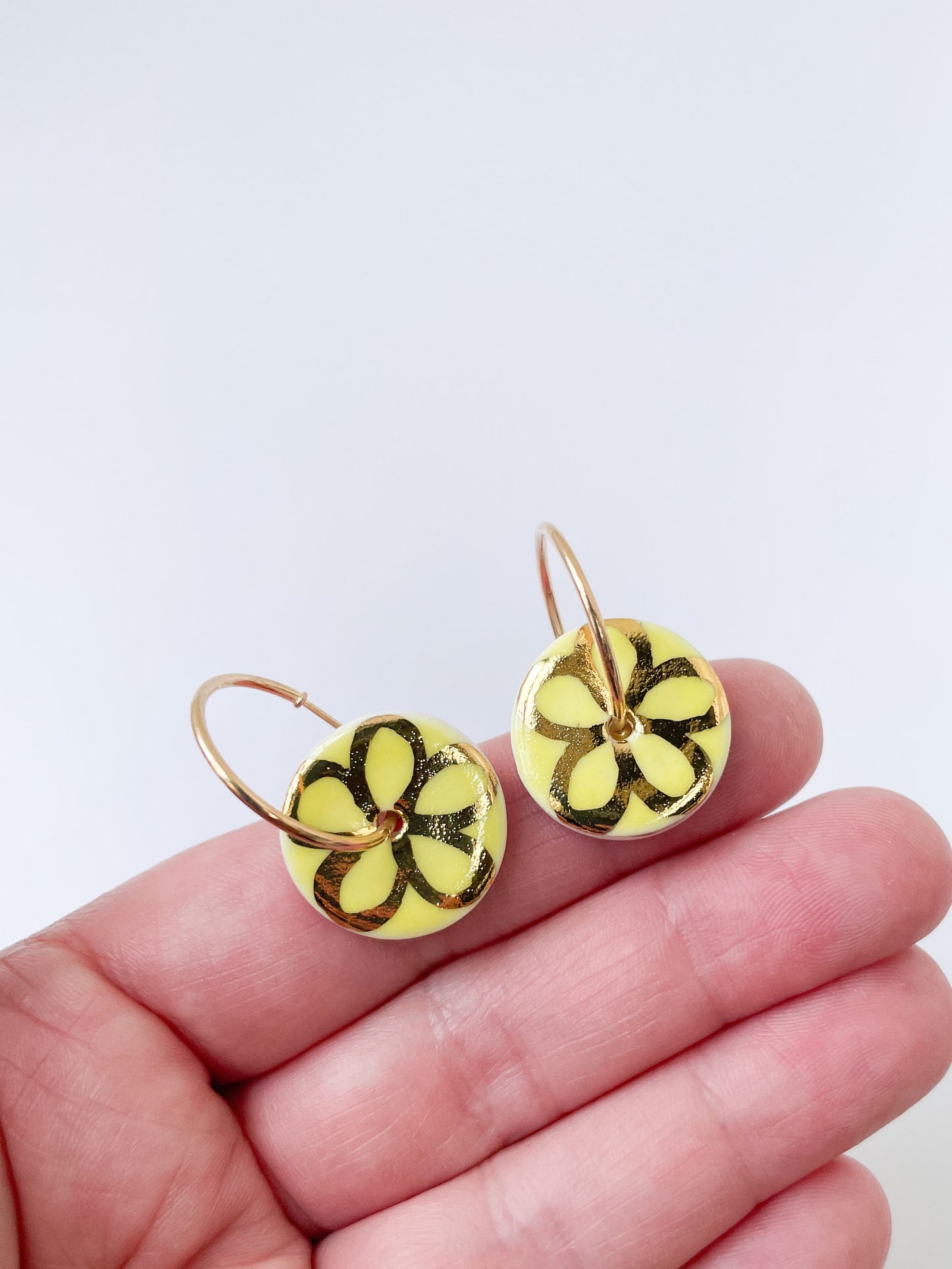 Round Yellow earring with gold flower design