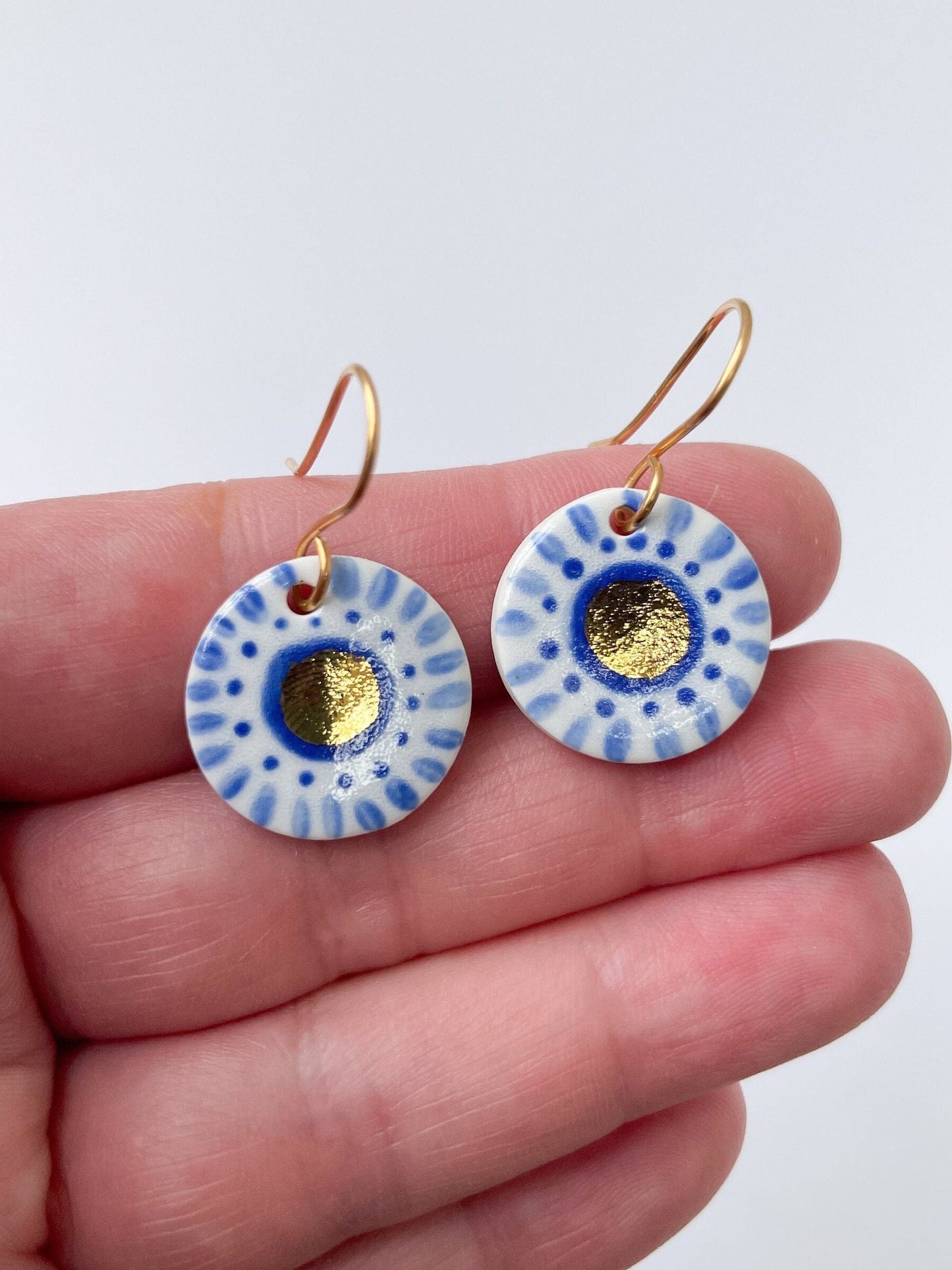 Hand painted white and blue dot earrings with gold lustre centre