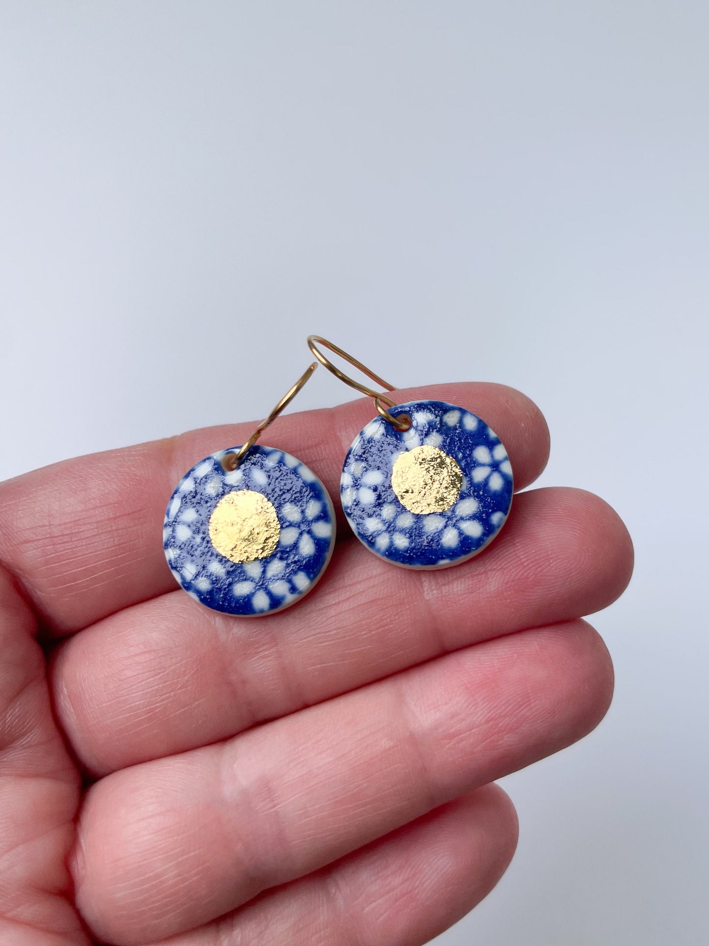 Blue earrings with white flowers pattern & gold lustre centre