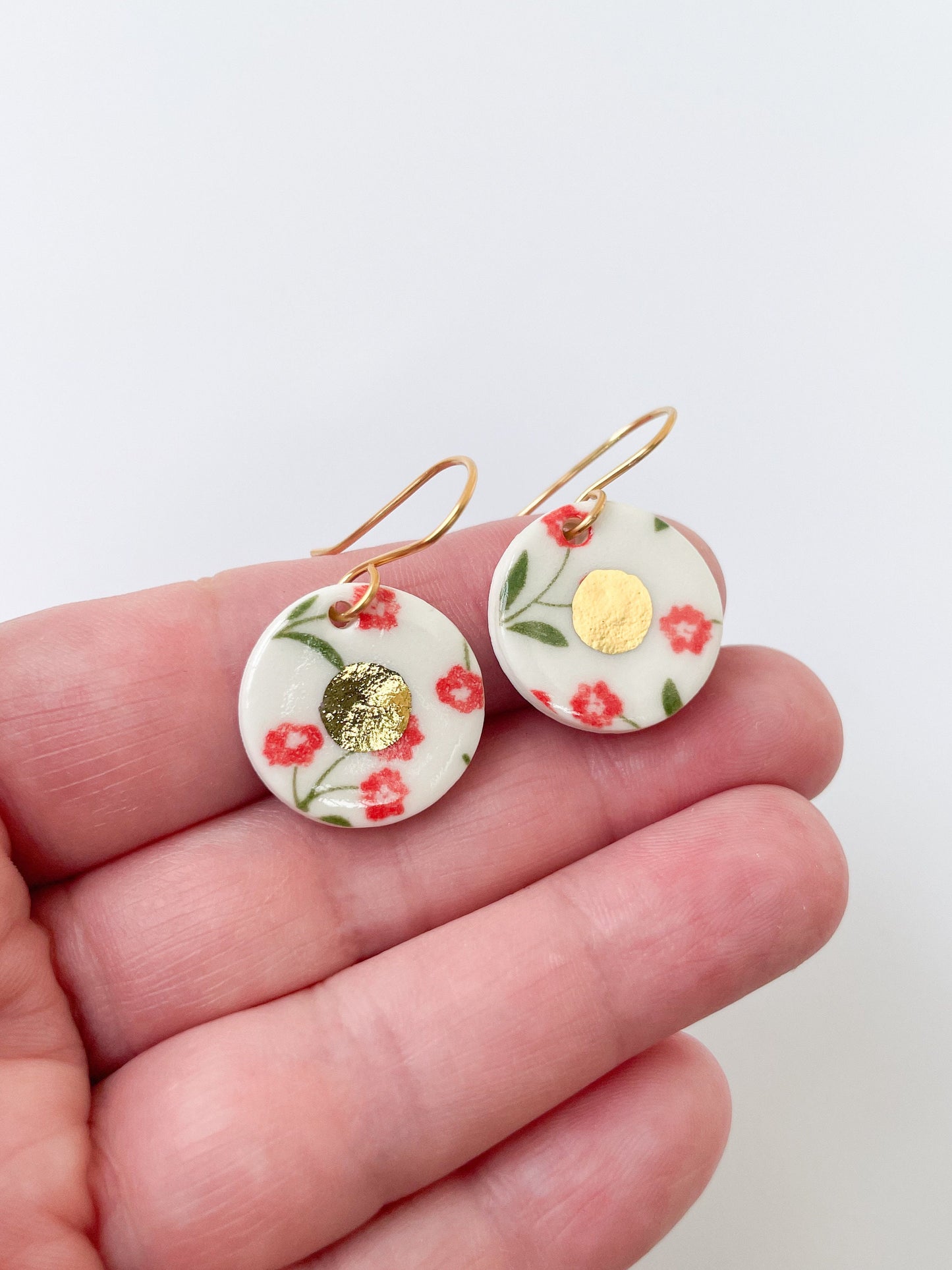 White round earrings with red flowers