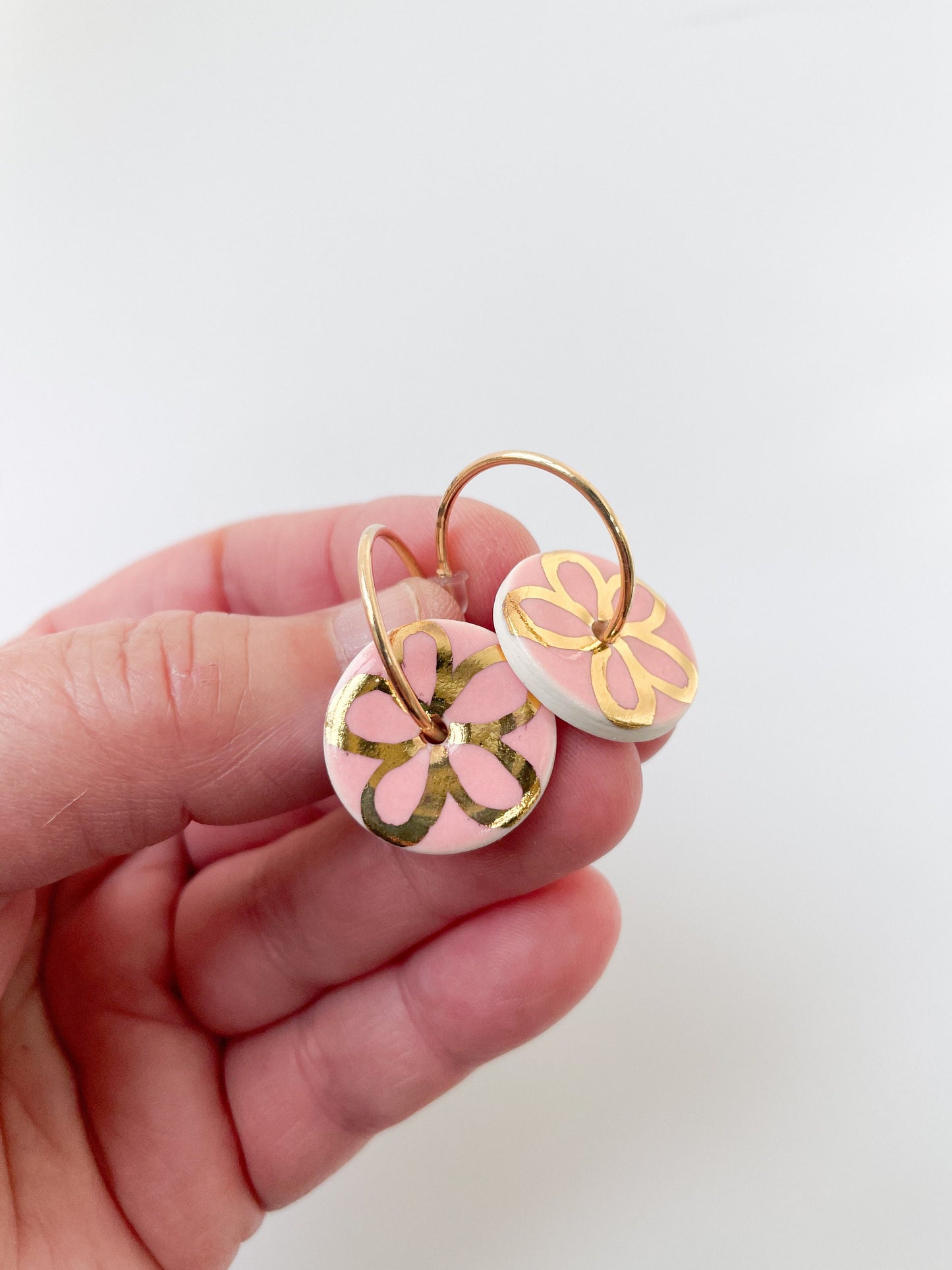 Round Pink earrings with gold flower design