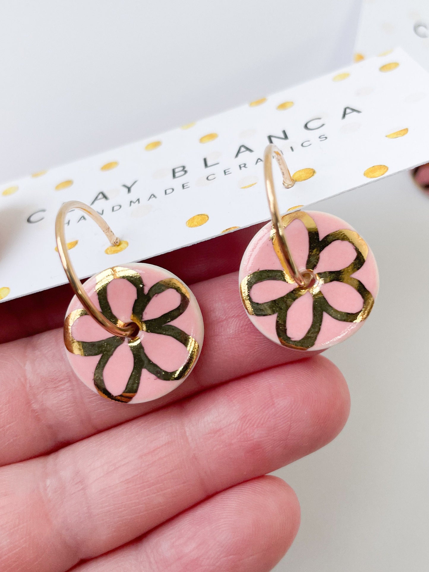 Round Pink earrings with gold flower design