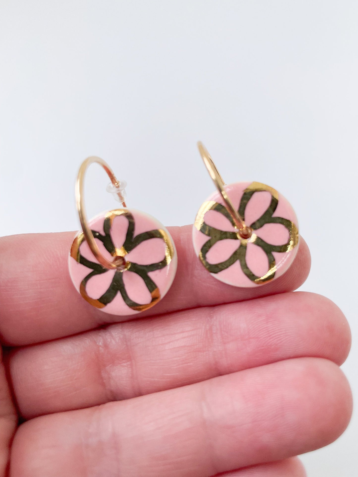 Round Pink earrings with gold flower design