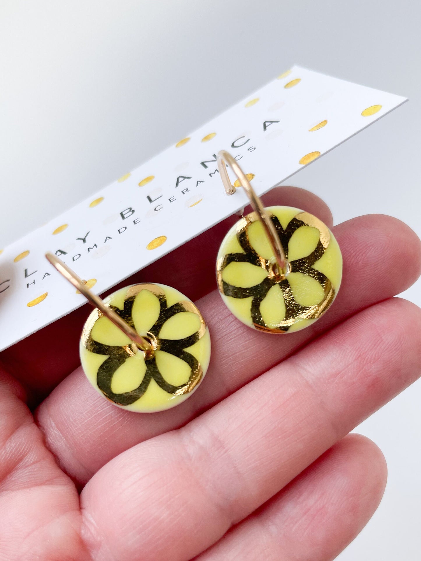 Round Yellow earring with gold flower design