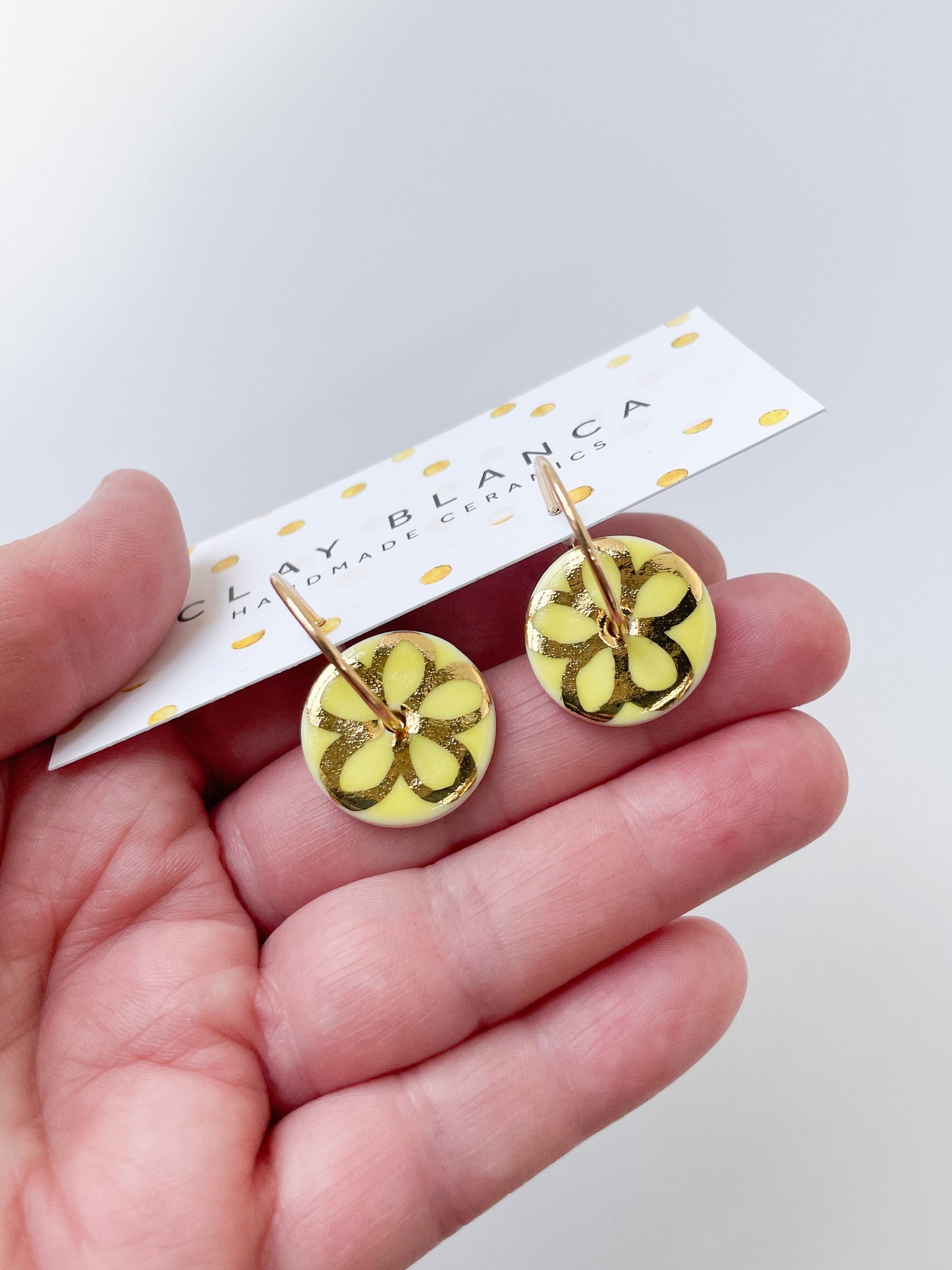 Round Yellow earring with gold flower design