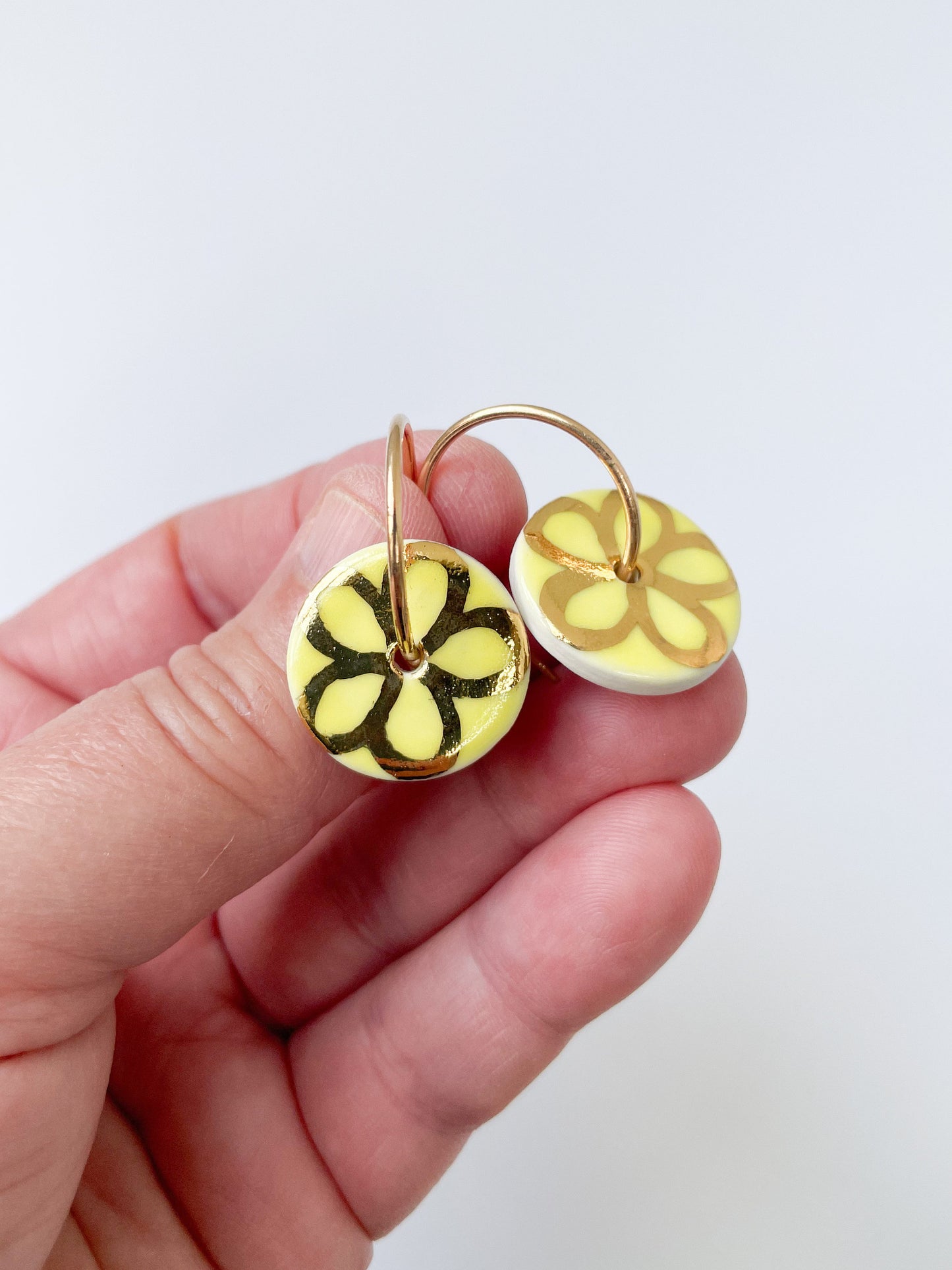 Round Yellow earring with gold flower design